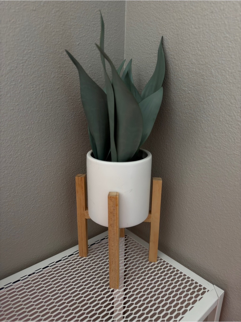 White Ceramic Planter with Wooden Stand and Green Faux Plant - Home Accents